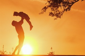 Father Lifting Young Son